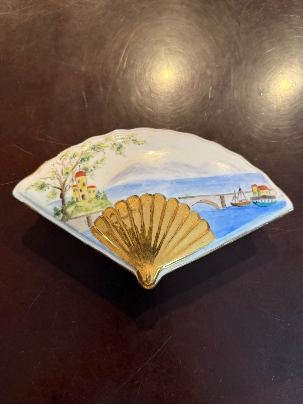 A Sweet Porcelain Trinket Box In The Shape Of A Fan With Gold Accents